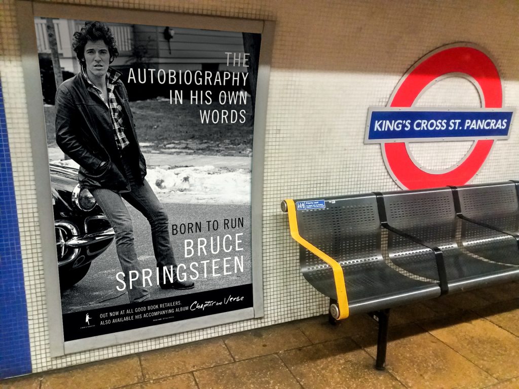 An advert for Bruce Springsteen displayed on the London Underground using 4 Sheet posters. This is at King's Cross St Pancras station.