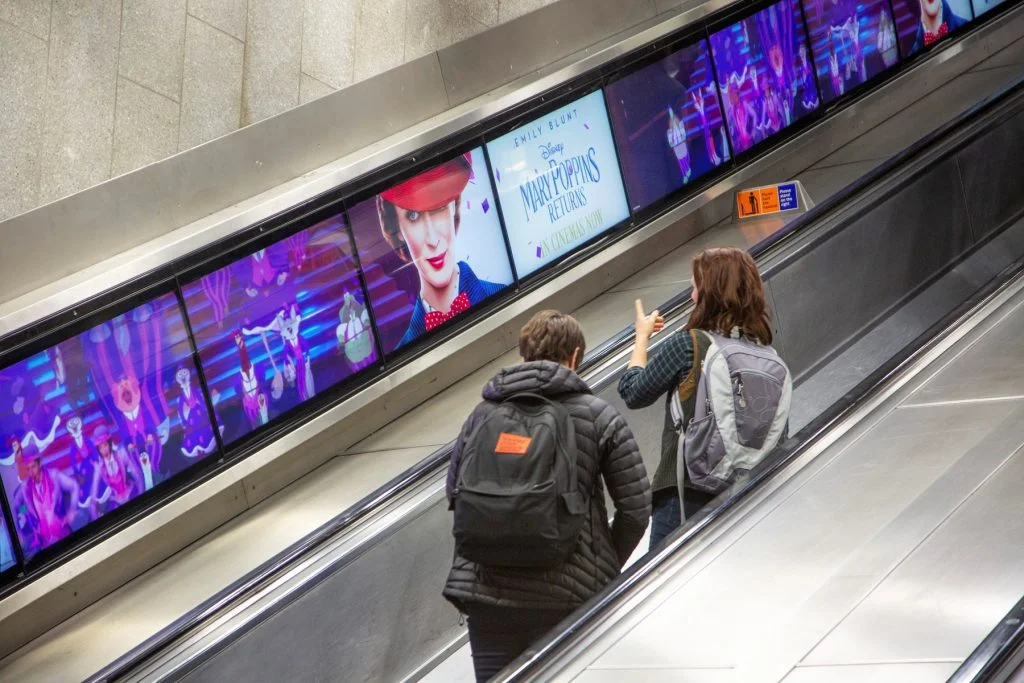 An advert for Mary Poppins on the London Underground using digital escalator ribbons.