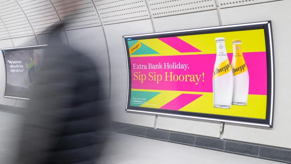 An advert for Schweppes displayed on the Elizabeth Line using 48-sheet sized posters.