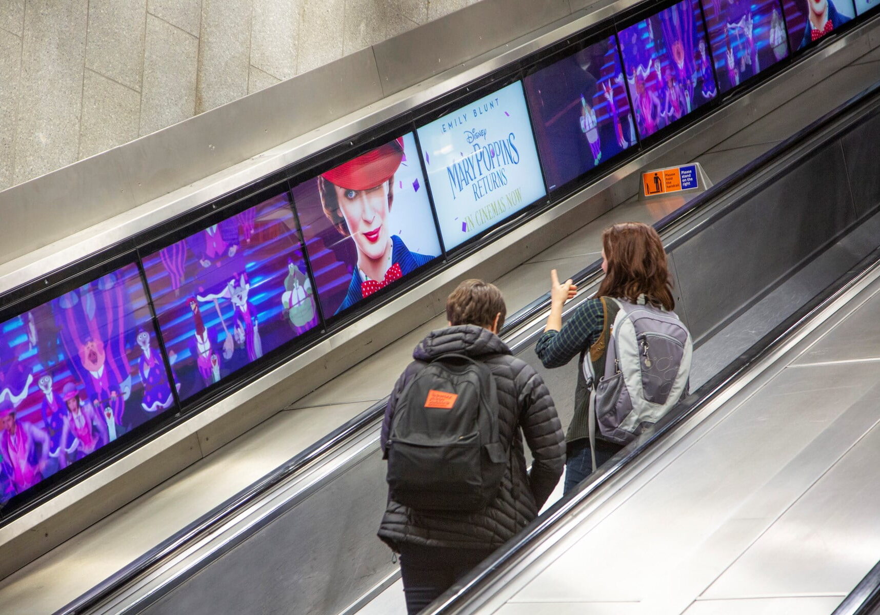 An advert for Mary Poppins on the London Underground using digital escalator ribbons.